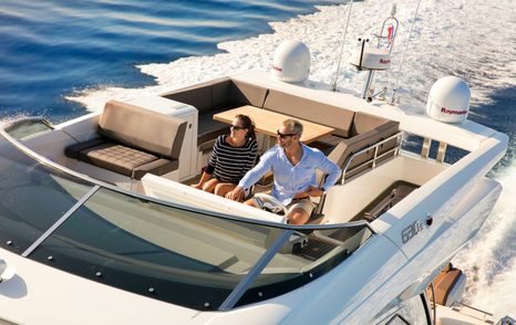 couple driving the Prestige 603 S yacht