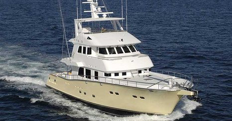 Nordhavn 75 EYF cruising underway showing full-displacement expedition yacht profile and raised pilothouse