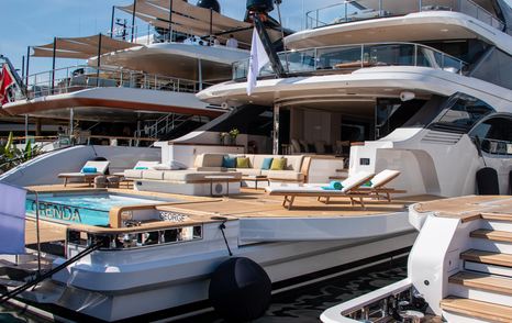 Benetti OASIS 40M yacht ORENDA for sale at Cannes Yachting Festival  yahct is shown from the pontoon on the starboard side aft looking towards the yacht, pool can be seen, yacht next to it on her starboard side, yacht unknown