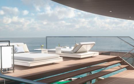 Sun loungers on wooden sundeck of Estrade superyacht with blue sky and sea in the background