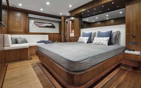 Large double bed in cabin on superyacht ALECTO