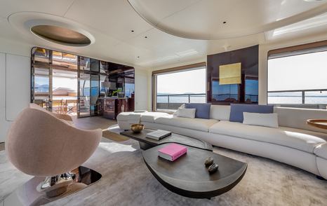 Seat and large sofa in lounge of Shabby superyacht