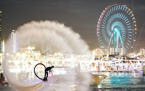 Dubai International Boat Show night image with jet fly