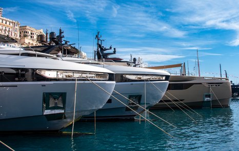 A line of superyacht bows berthed in Port Hercule