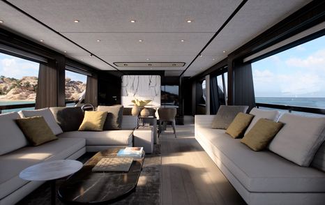 The Ferretti 940 salon boasts large sofas running along either side of the yacht, and large full height windows for expansive views out