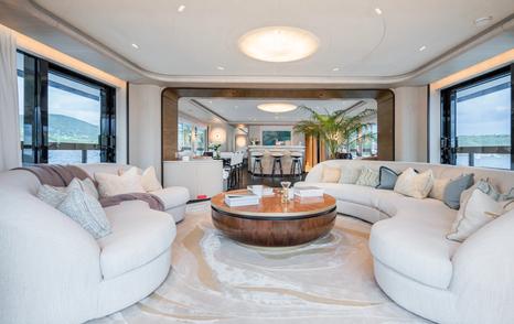 Spacious salon with cream furnishings on superyacht M
