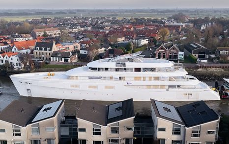 Feadship superyaclt Vanish III attached to tugboats along dutch canals