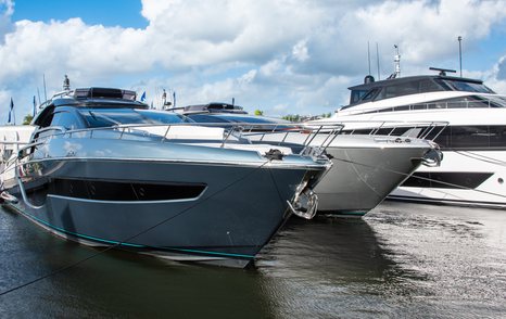 Motor yachts berthed in a line at FLIBS