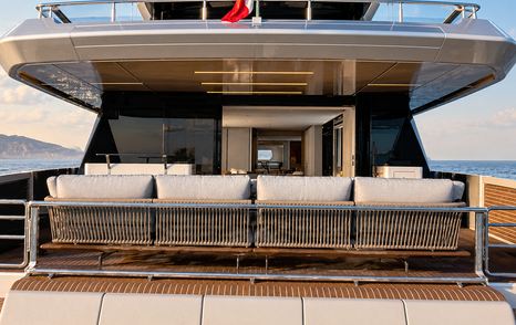 Rendering of Ferretti INFYNITO 100 Superyacht aft deck shaded seating 