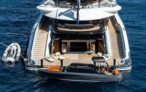 Superyacht Kismet beach club with tender being deployed 