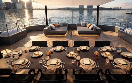 Rendering of 41M EXP Aegean Project Obsidean Blade explorer yacht upper deck with alfresco dining and shaded seating 