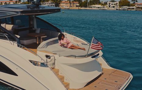 Princess V55 aft view showing hydraulic swim platform and sunpad