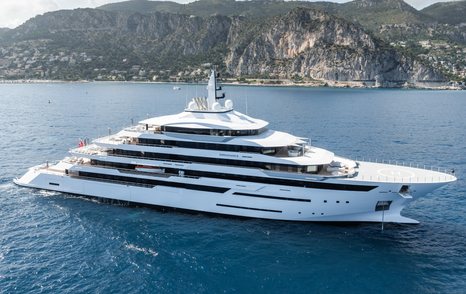 Superyacht RENAISSANCE at sea with cliffs in the background