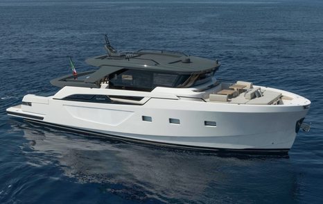 Bluegame BGX63 motor yacht at anchor side view 