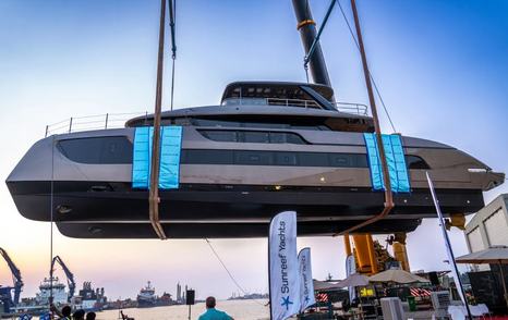 Sunreef Ultima 88 suspended in the air at launch side view 