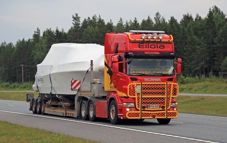 boat on back of transportation truck