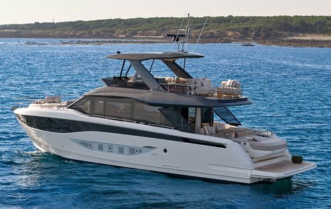 Prestige F6.7 yacht at anchor stern view 