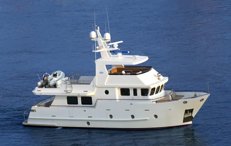 Bering 65 motor yacht underway side view 