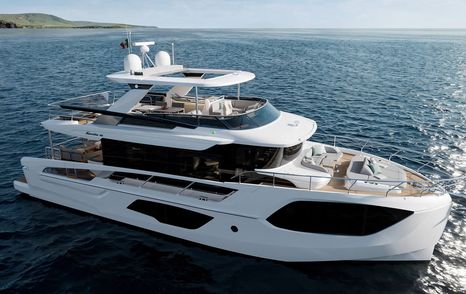 Absolute Navetta 66 motor yacht at anchor side view 