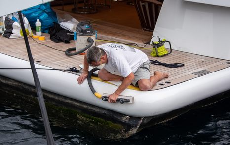 image shows yacht crew working on the bathing platform of a yacht at MYS 2024