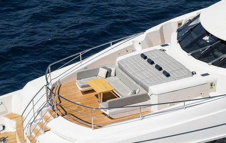Superyacht Berco Voyager foredeck with sunpads and U-shaped seating