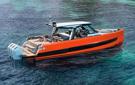 A Fjord 490 Sport at anchor, showcasing a bright orange hull and three powerful outboard motors