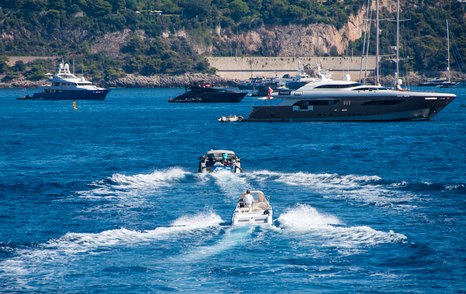 luxury shuttle tenders to superyachts on anchor in Bay of Monaco 