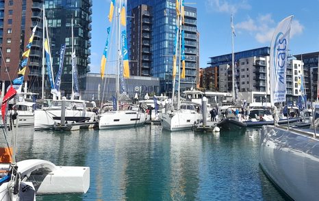 Yachts berthed with flags at South Coast & Green Tech Boat Show