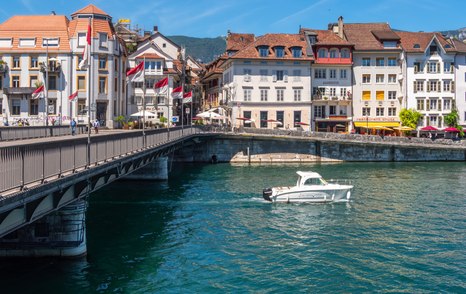 air draft boat passing under bridge