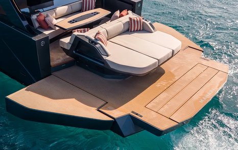 Manari 52 boat stern with fold out balcony on calm water 