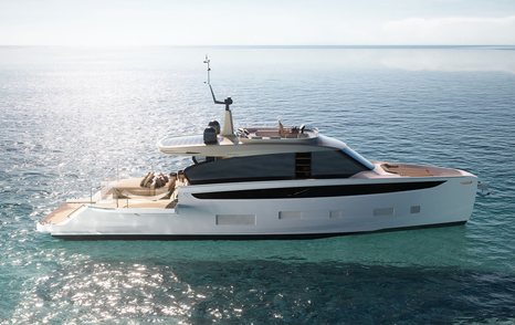 Azimut Seadeck 7 motor yacht mid aerial view over starboard side profile, stationary in calm sea on bright day