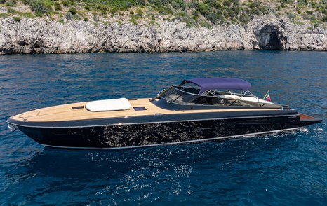 Itama 62RS motor yacht at anchor side view