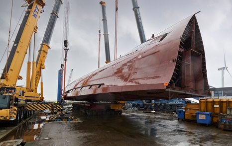 Hull of Project Sparta being turned by crane