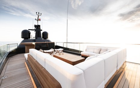 The flybridge onboard SAN offers comfortable U-shaped seating