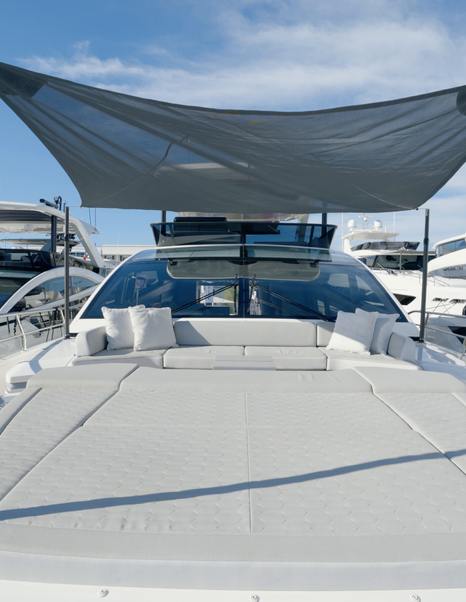 Pearl 73 foredeck sunpad beneath the extended shade