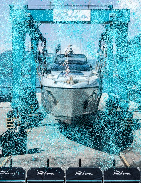 Bow shot of First Riva 96' Argo Super motor yacht at launch with blue confetti