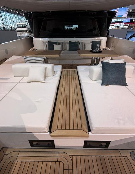 Bluegame-BGX83-Review-foredeck-sunpad-and-dining-area-under-canopy
