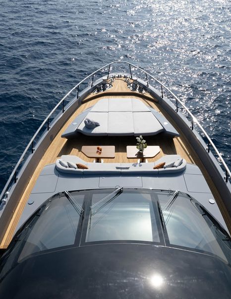 Mangusta 104 REV motor yacht foredeck with integrated grey sunpads 