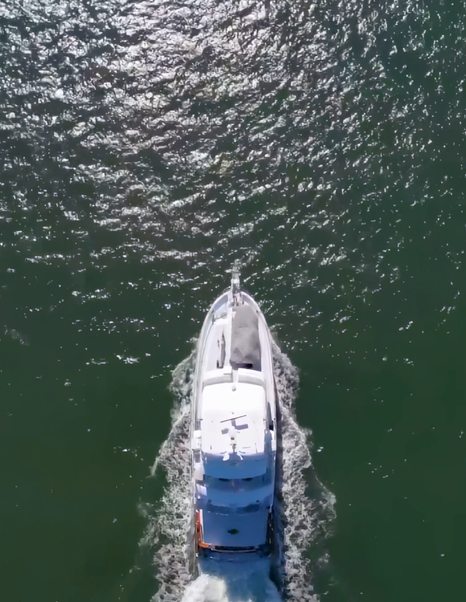 Aerial view of Nordhavn 75 EYF underway highlighting wide beam, foredeck tender and expedition design