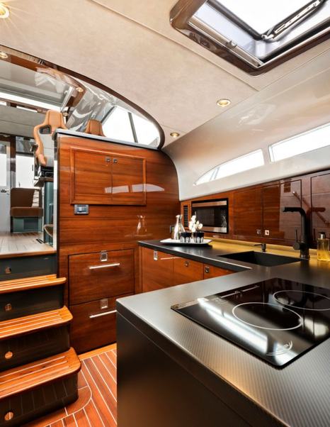 Palm Beach GT50 RS Boat interior galley with L-shaped counter and wooden features