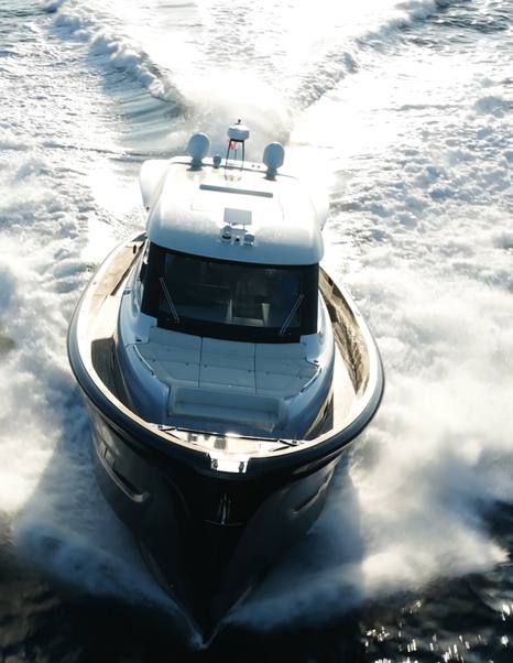 Solaris-Power-60-Coupe-Review-aerial-bow-on-view-during-sea-trial-with-wake-astern