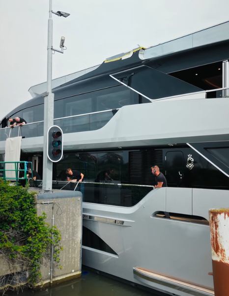 Workers on Van der Valk 40m Superyacht Shine going through Dutch canals