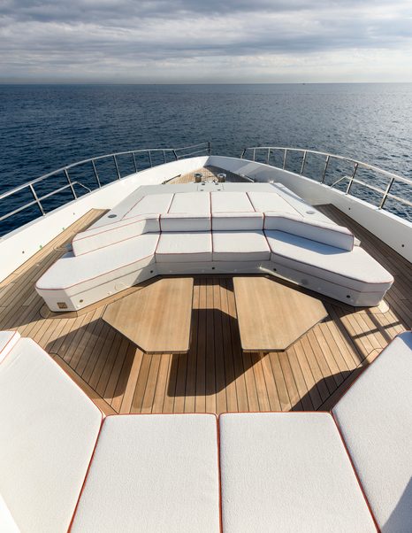 Alia Superyacht Ximena foredeck with grey sunpads and wooden detailing 