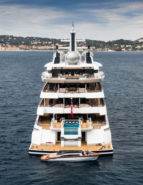 Stern shot of Superyacht Amadea with tender