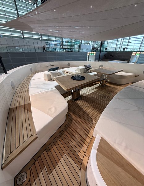 Bluegame-BGX83-Review-foredeck-lounge-seating-with-table-and-sunshade