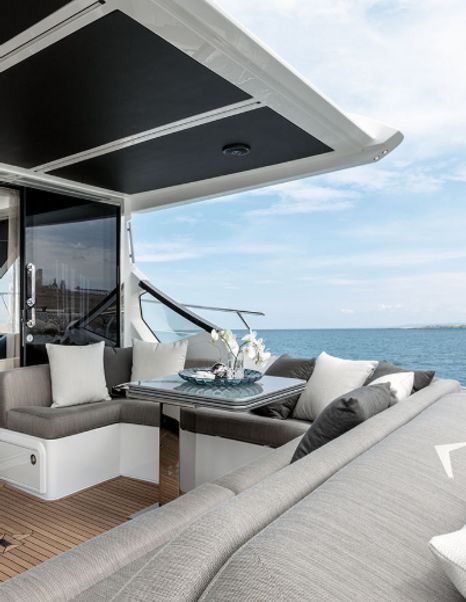 The exterior lounging area on board an Azimut S6 motor yacht.