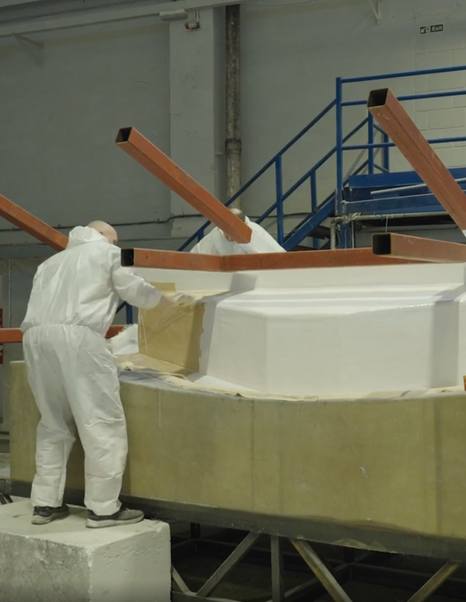 Workers painting new Princess C48 motor yacht