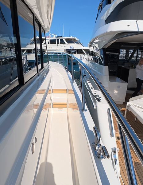 Maritimo M50 wide side deck walkway with handrails and step access to foredeck