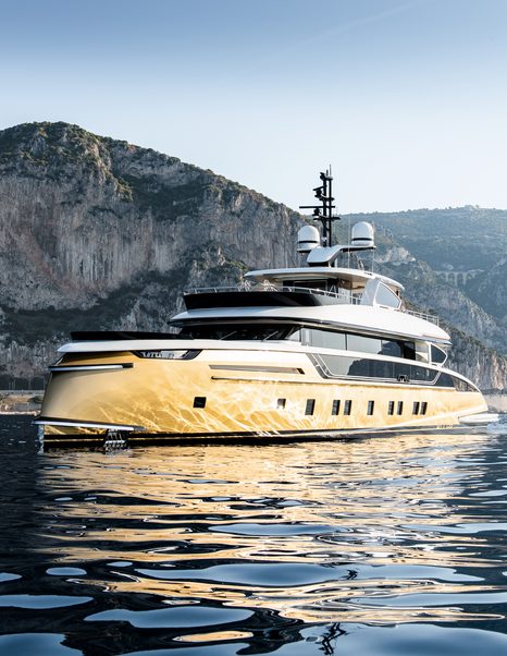 Superyacht STEFANIA on water with coast behind