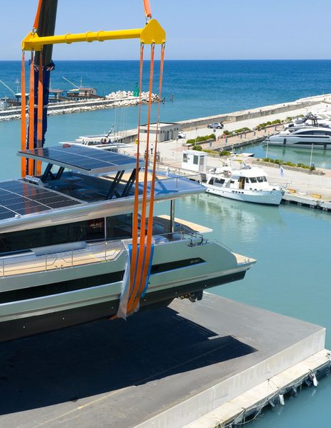 Aft of Silent Yachts SY80 catamaran being lowered into water